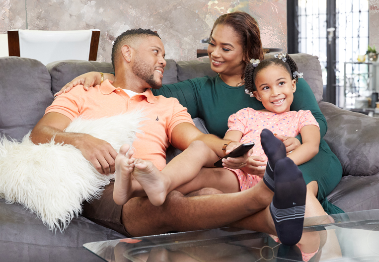 Happy loyal customers, a husband and wife, enjoying quality time with their daughter.