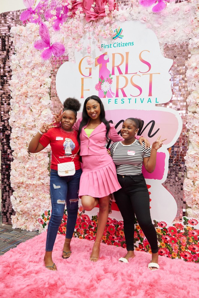 Posing under the girlks first logo