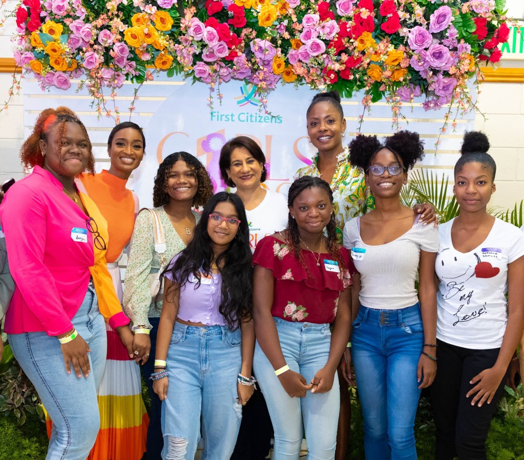 Group CEO Karen Darbasie poses with girls at the Girls First Festival 2023