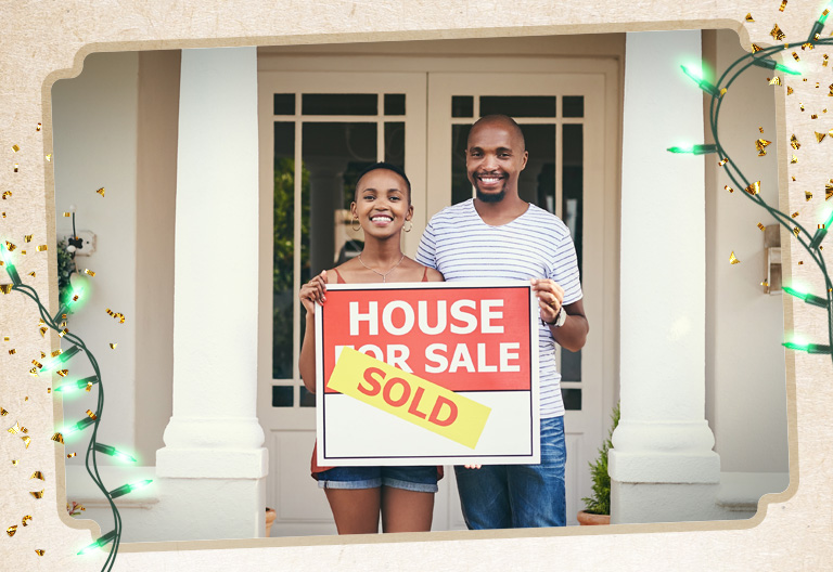 Customers standing in front of their new house