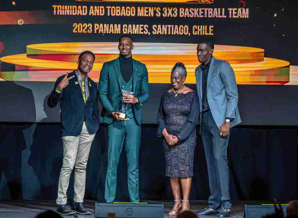 Ms. Petal-Dawn Hinkson, niece of netball sporting icon Lystra Lewis presents the Lystra Lewis Awards to some of the members of the Trinidad & Tobago’s Men’s 3x3 Basketball Team who won bronze in the Pan American Games 2023, held in Santiago, Chile