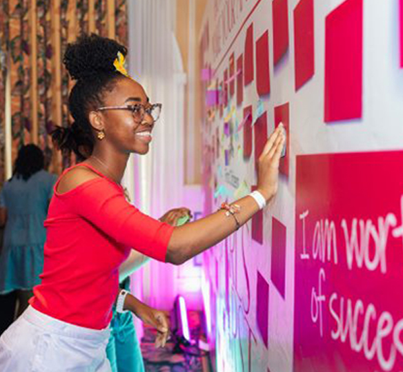 A young girl enjoying a moment at the Girls First Festival 2025