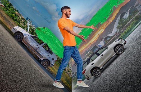 Young man pointing to his brand new suv.