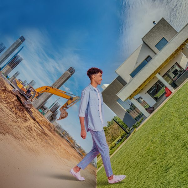 financial education hub guy standing between construction to completion