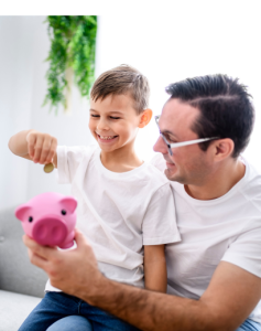 Father holding piggybank for son to put in coins Financial Education Hub 