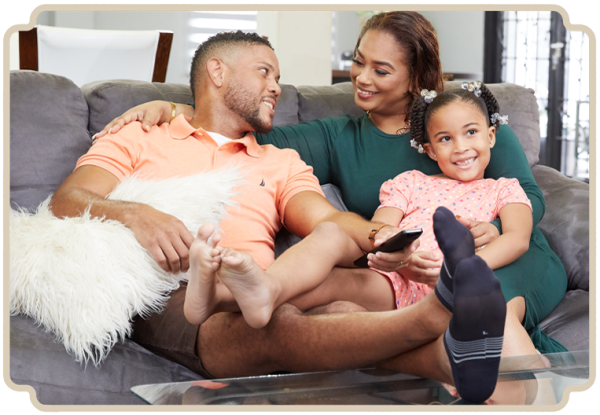 Customer Onboarding family relaxing on couch