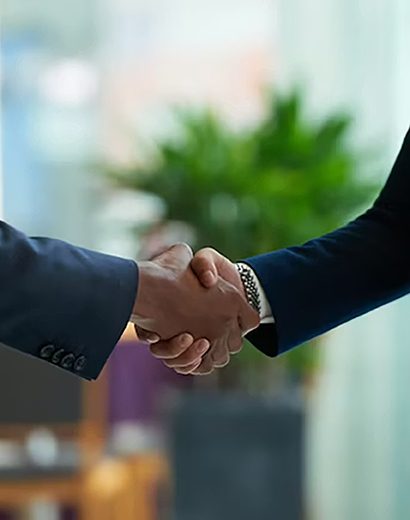 Firm handshake representing collaboration